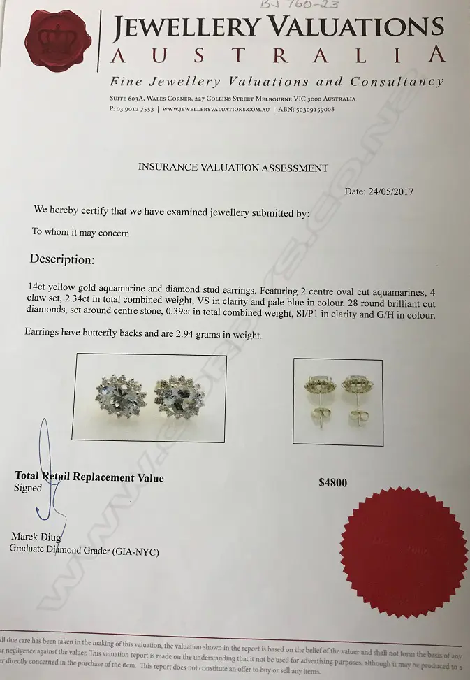 A pair of 14ct. gold aquamarine and diamond stud earrings Image 1++