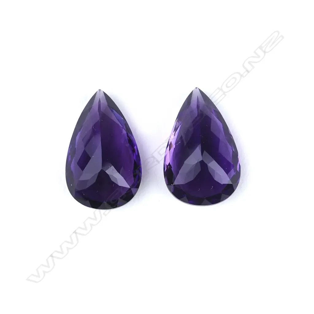 A pair of amethyst pear-cut gemstones Image 1++