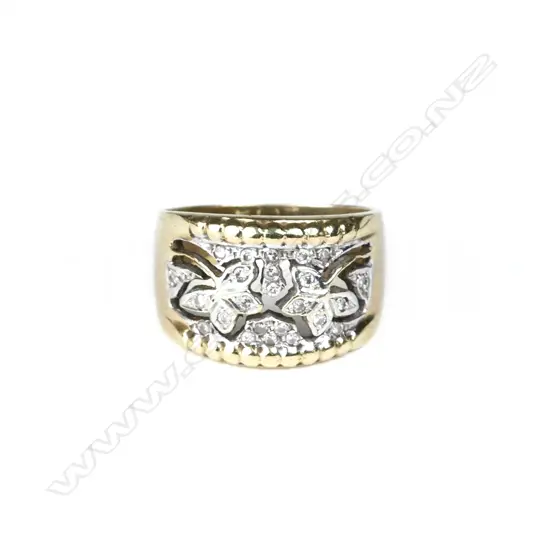 A 9ct. gold and diamond ring