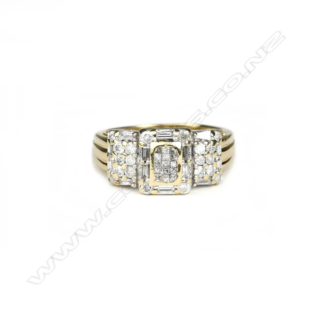 A 14ct gold and diamond ring Image 1++