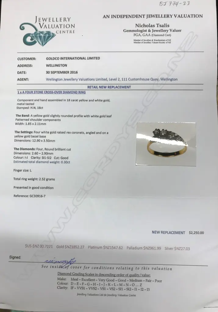 An estate 18ct. yellow and white gold four diamond ring Image 1++