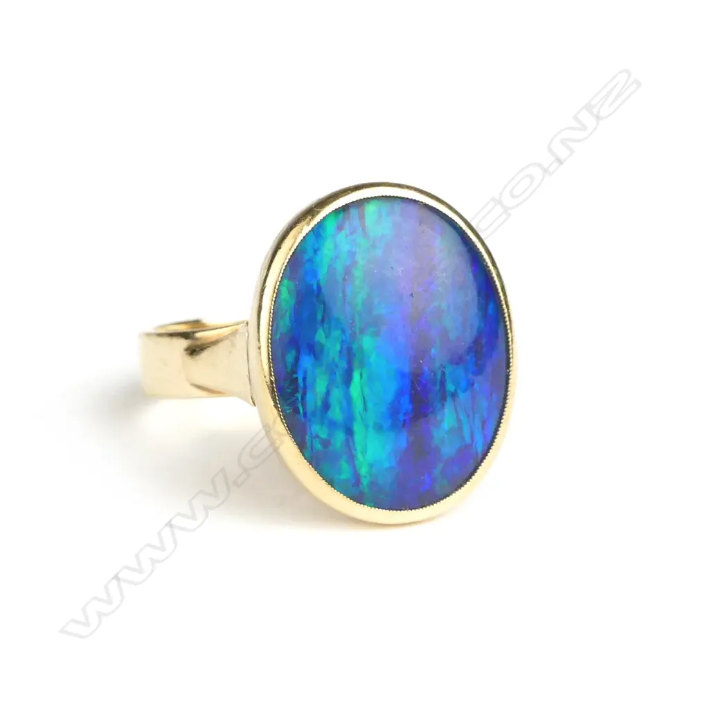 An estate substantial 9ct. yellow gold and opal dress ring Image 1++