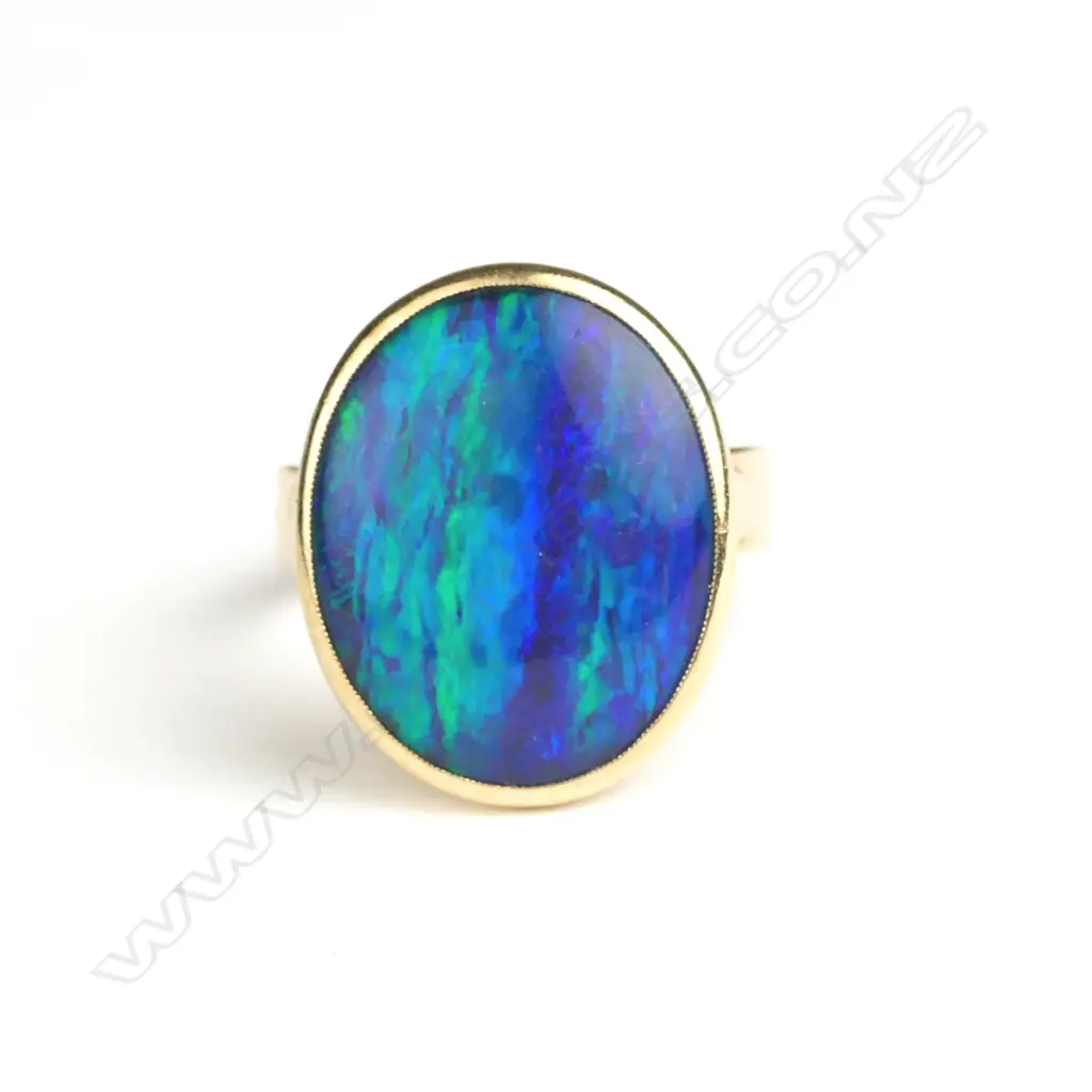 An estate substantial 9ct. yellow gold and opal dress ring Image 1++