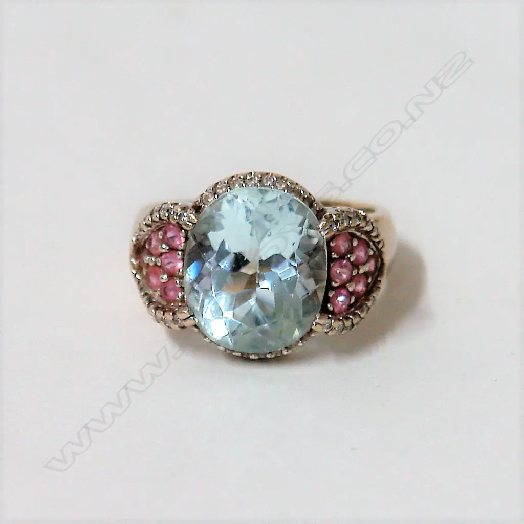 A lady's modern 14ct. white gold aquamarine and pink sapphire dress ring Image 1++