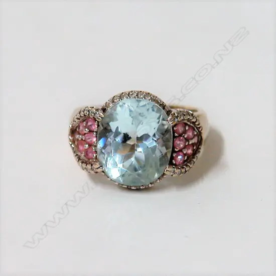 A lady's modern 14ct. white gold aquamarine and pink sapphire dress ring