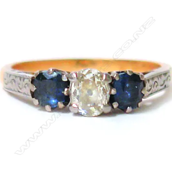 A lady's estate 18ct. yellow gold diamond and sapphire three-stone ring