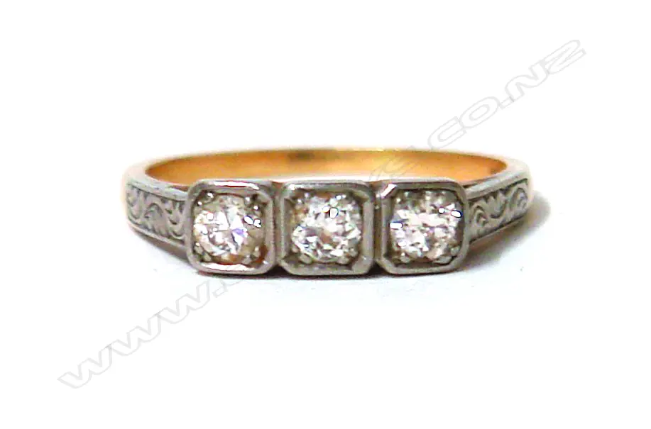 A lady's estate 18ct. yellow and white gold three-stone diamond ring Image 1++