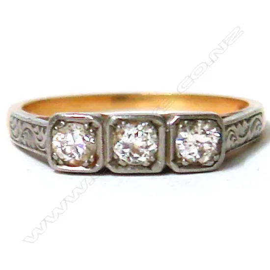 A lady's estate 18ct. yellow and white gold three-stone diamond ring