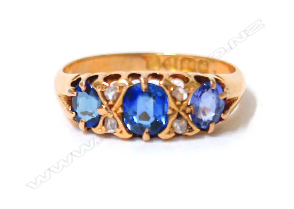 An Edwardian 18ct. yellow gold sapphire and diamond bridge ring Image 1++