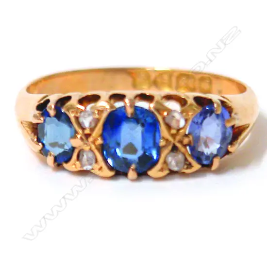 An Edwardian 18ct. yellow gold sapphire and diamond bridge ring