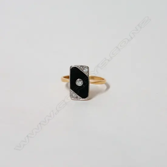 An Art Deco 18ct. yellow gold diamond and black onyx ring