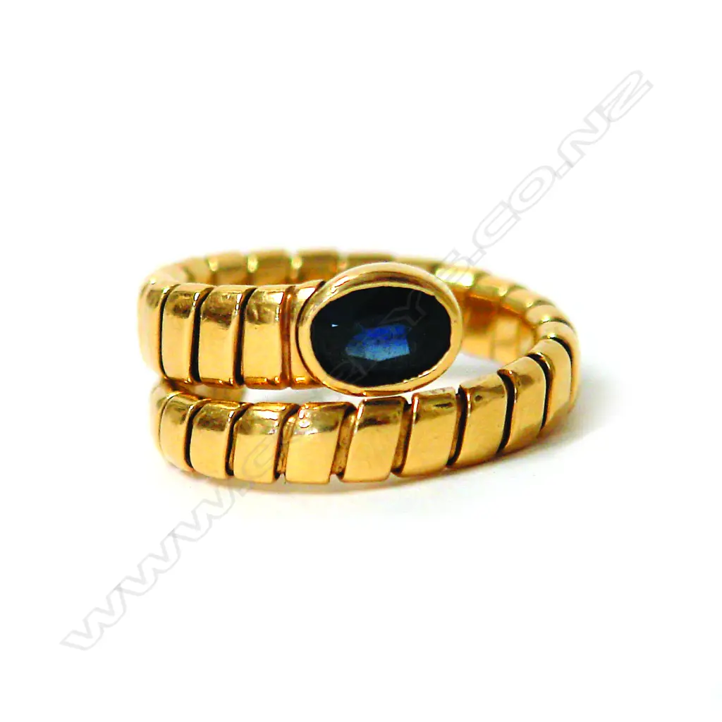 An 18ct. yellow gold and sapphire snake style ring Image 1++