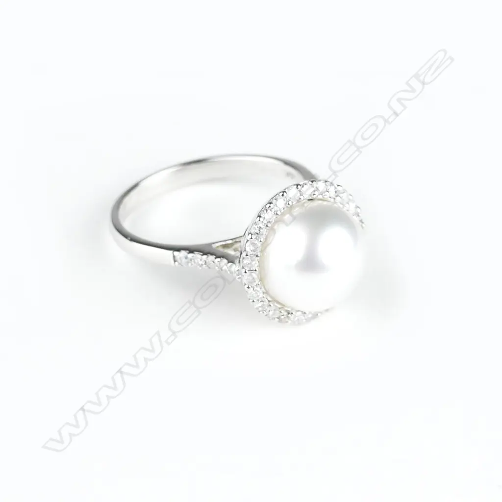 A 14ct. white gold pearl and diamond ring Image 1++