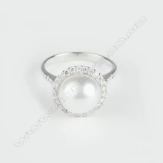 A 14ct. white gold pearl and diamond ring