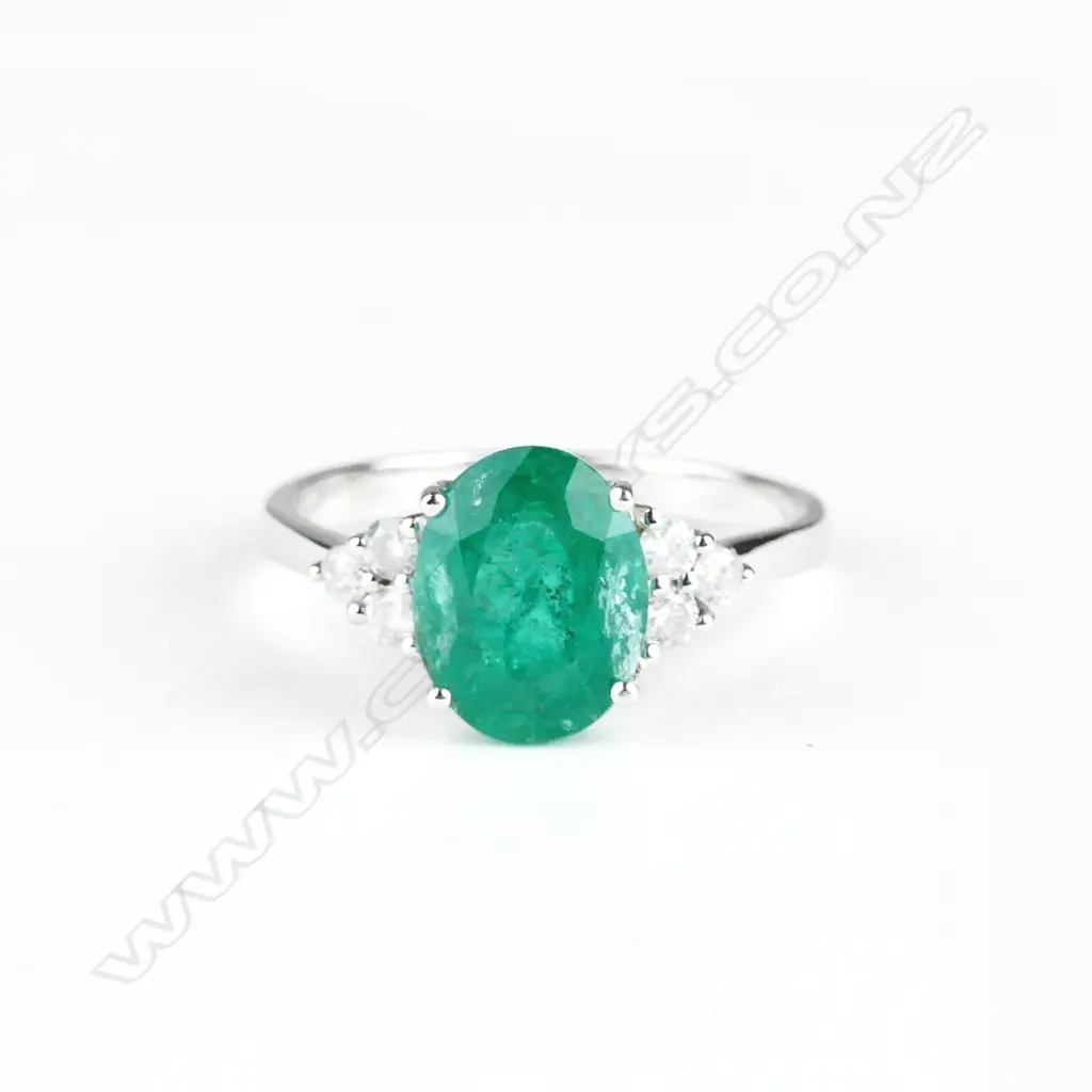 A 14ct. white gold emerald and diamond ring Image 1++