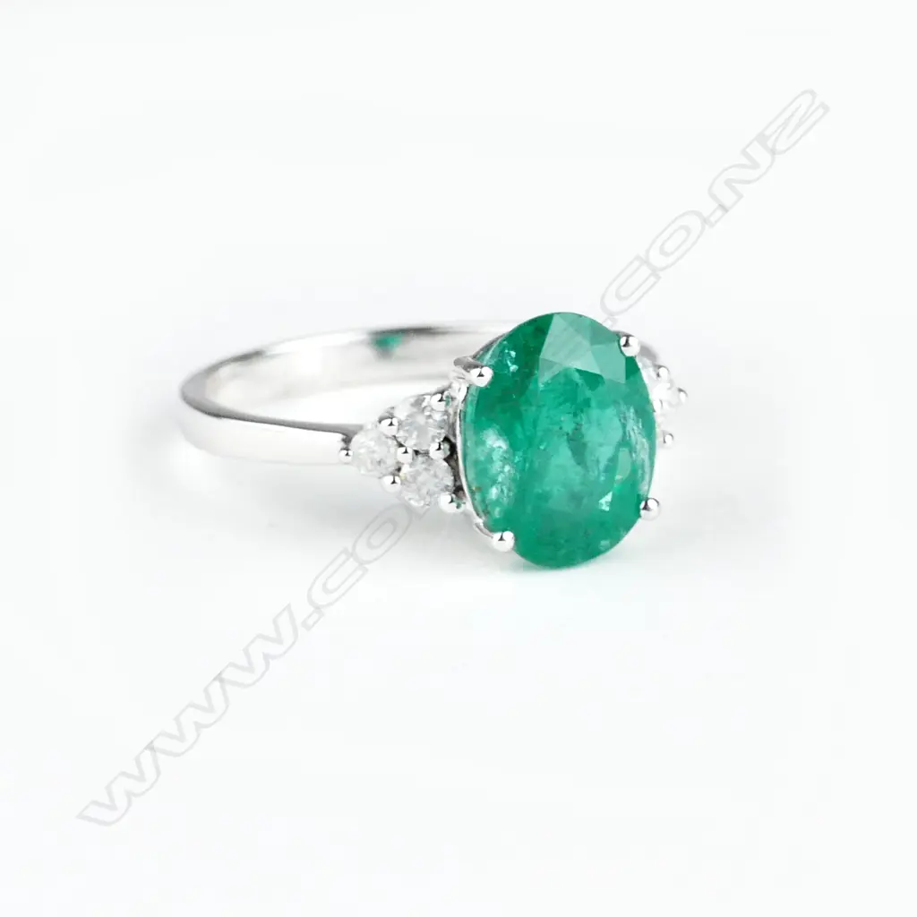 A 14ct. white gold emerald and diamond ring Image 1++