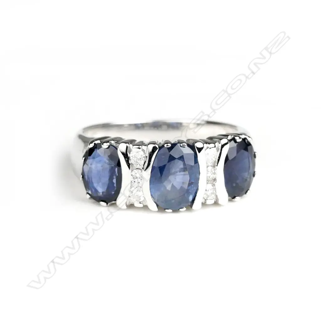 A 14ct. white gold sapphire and diamond ring Image 1++