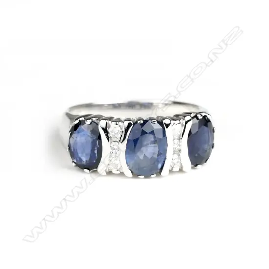 A 14ct. white gold sapphire and diamond ring