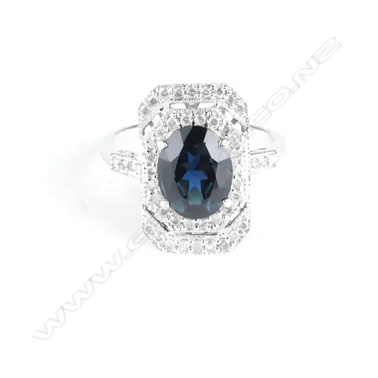 An 18ct. white gold sapphire and diamond Art Deco style ring
