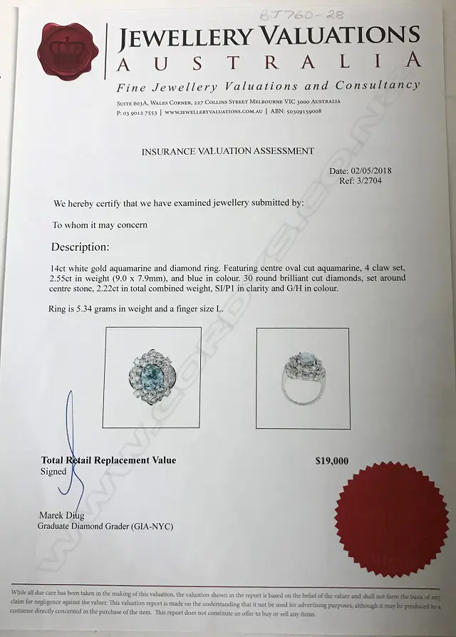 An impressive 14ct. white gold aquamarine and diamond dress ring Image 1++