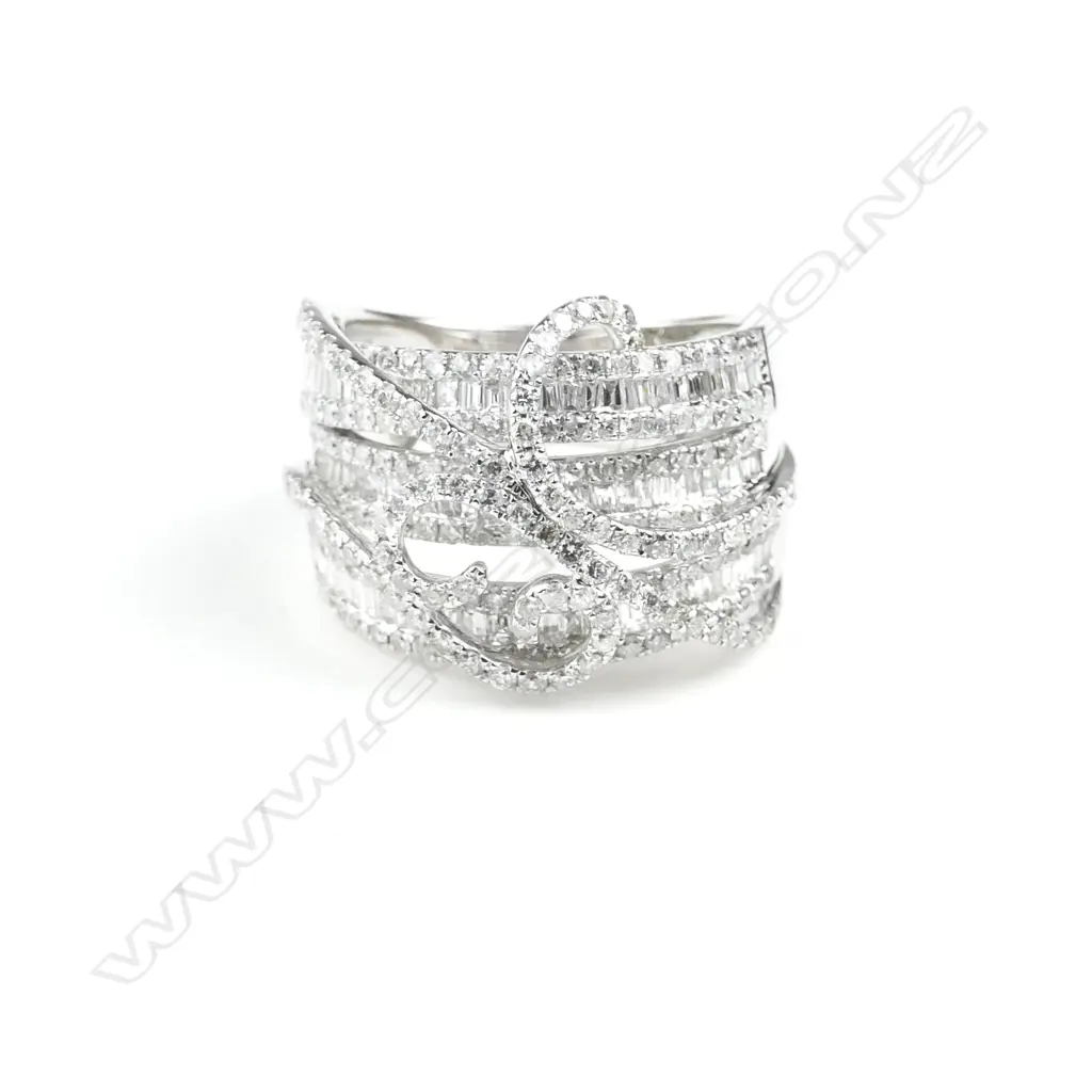 An 18ct. white gold and diamond dress ring Image 1++