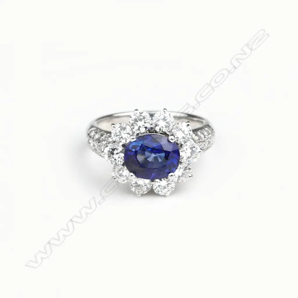 An 18ct white gold sapphire and diamond ring Image 1++