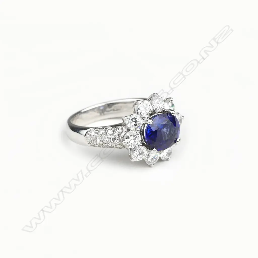 An 18ct white gold sapphire and diamond ring Image 1++