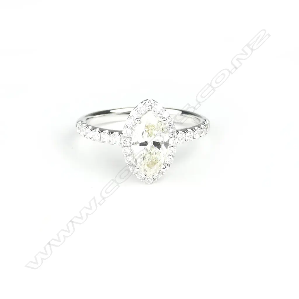 An 18ct. white gold and solitaire diamond ring Image 1++