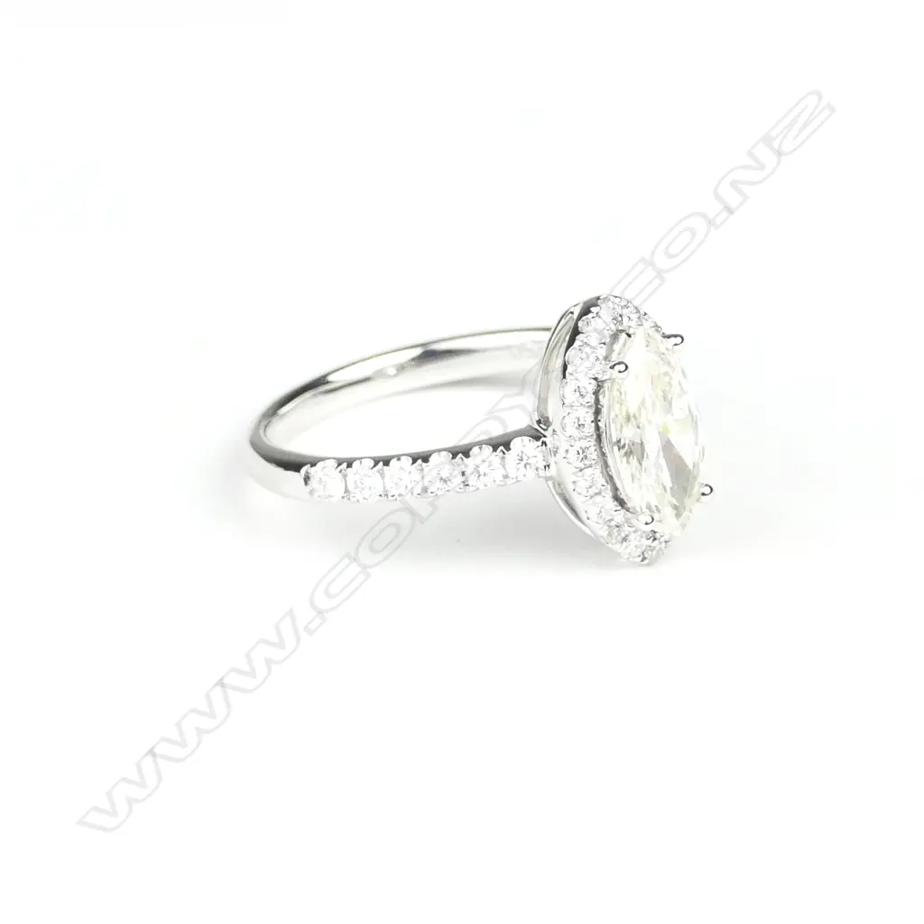 An 18ct. white gold and solitaire diamond ring Image 1++