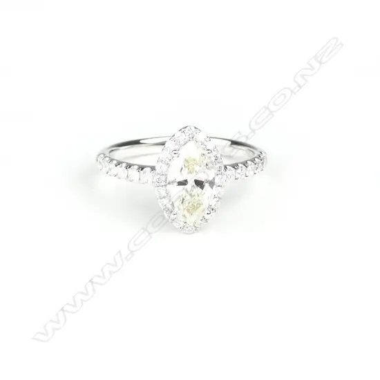 An 18ct. white gold and solitaire diamond ring