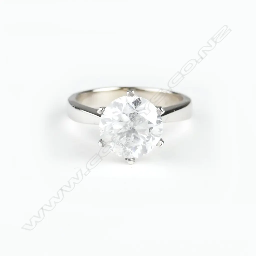 An 18ct. white gold and diamond solitaire ring Image 1++