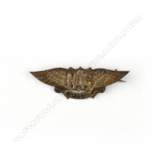 A silver N.A.C. pilot's badge