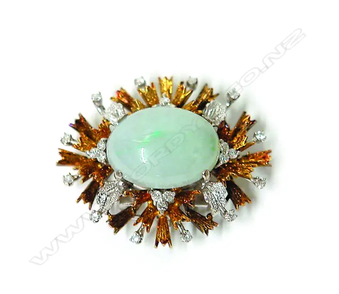 A stylish 1970s 18ct. yellow and white gold diamond and jade brooch Image 1++