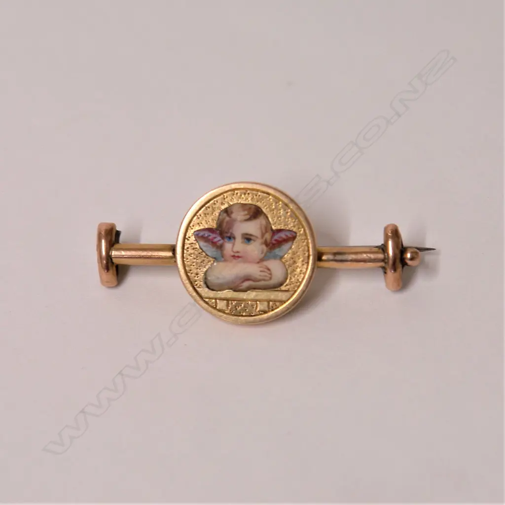 A 19thC 15ct. yellow gold and cherub enamelled brooch Image 1++
