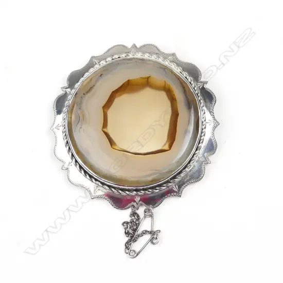 A silver and agate brooch
