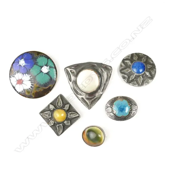A collection of six brooches