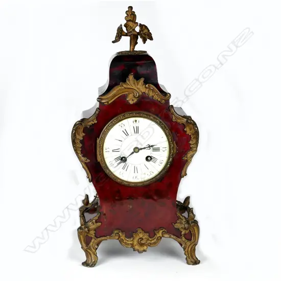 A French simulated red tortoiseshell cased mantel clock