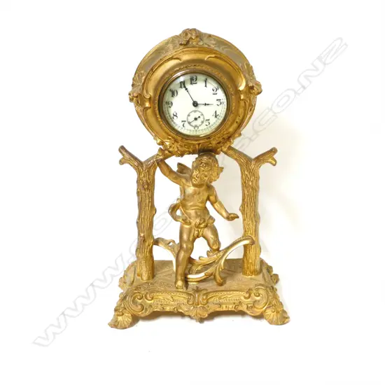 An Edwardian gilt metal sculptural table clock
