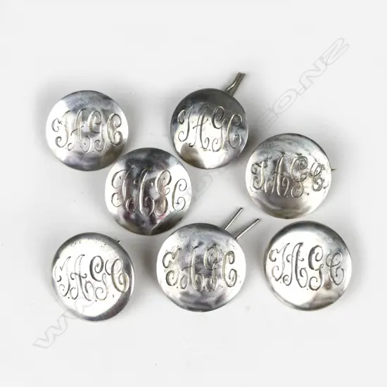 Six silver Kohn & Co. golf buttons