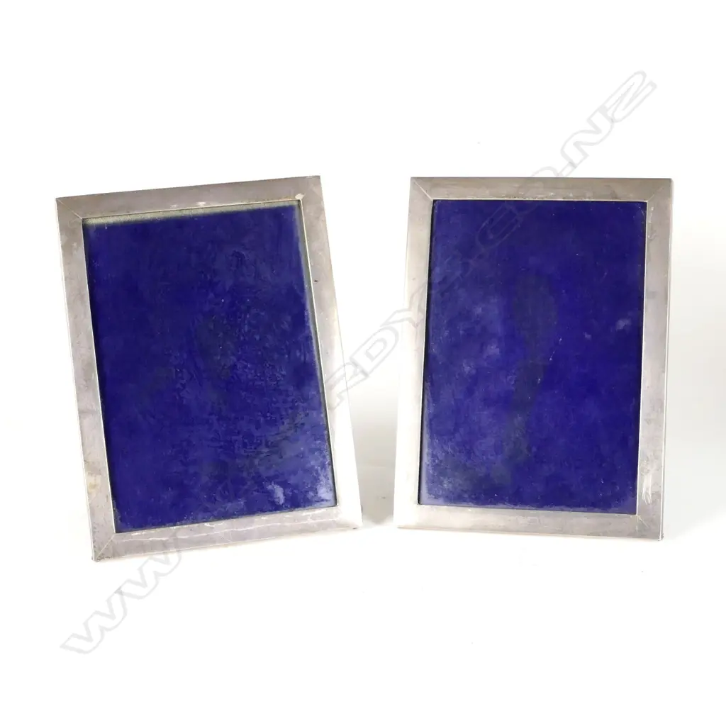 A pair of 20thC plain rectangular silver photo frames Image 1++
