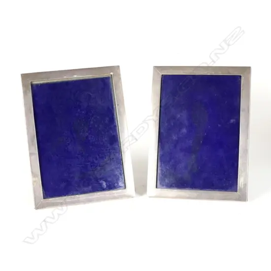 A pair of 20thC plain rectangular silver photo frames