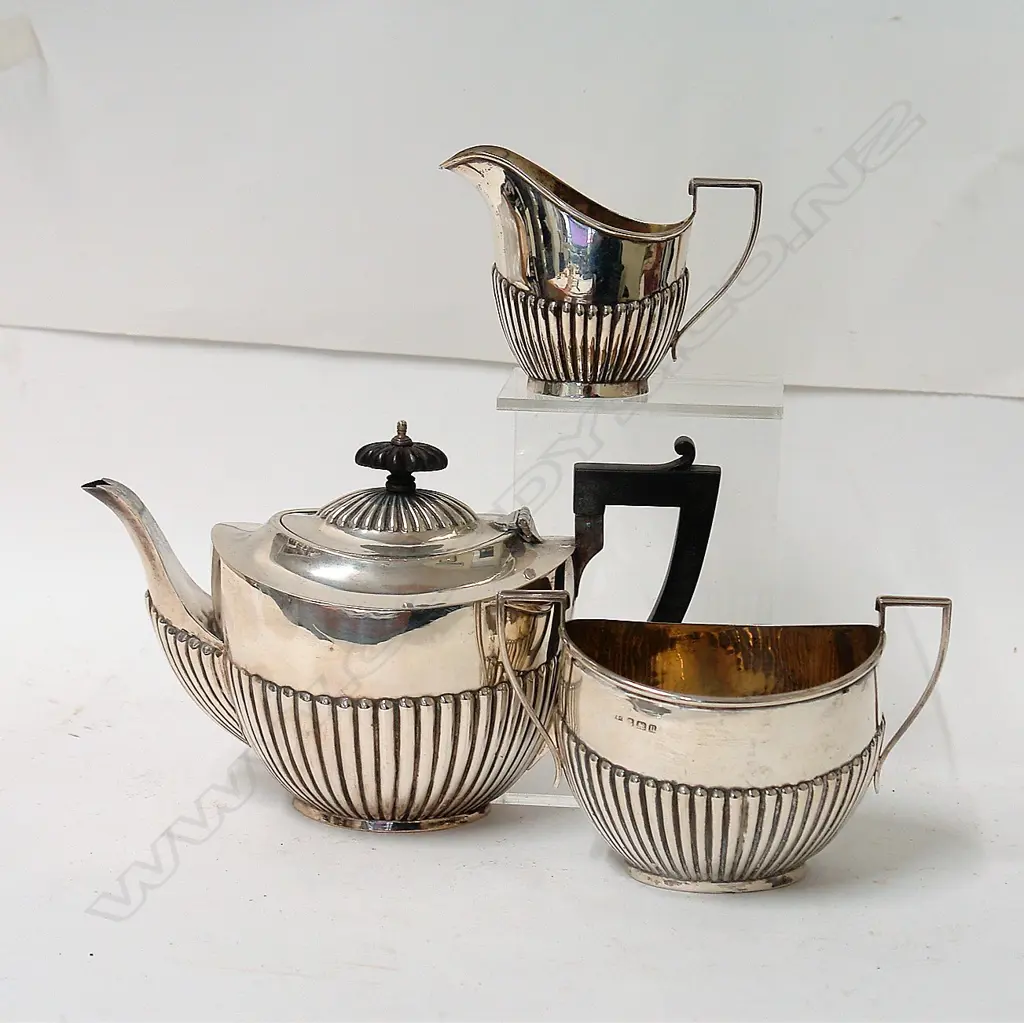 An early 20thC silver three-piece tea service Image 1++