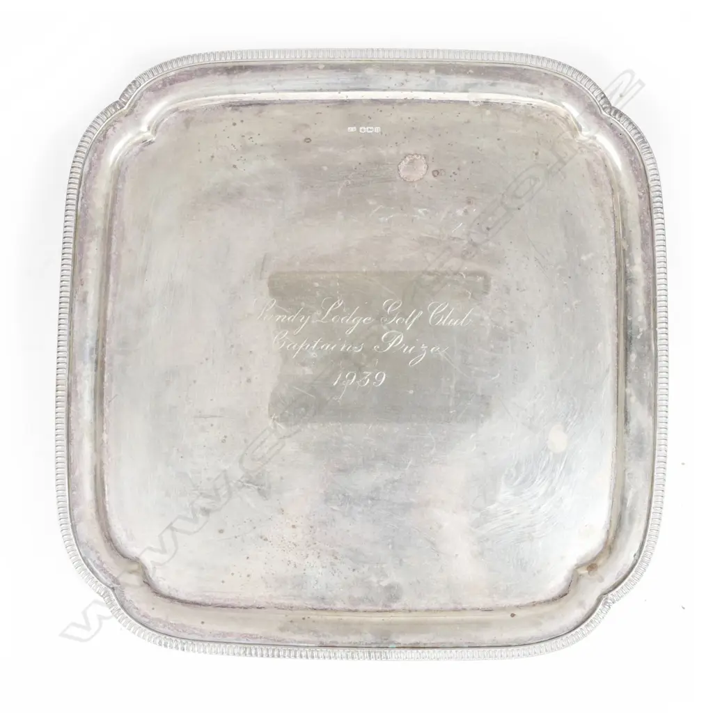 A heavy silver Georgian Revival salver of square shape Image 1++