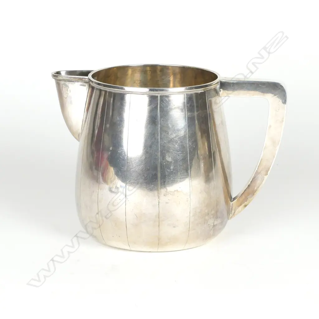 An impressive silver pitcher Image 1++