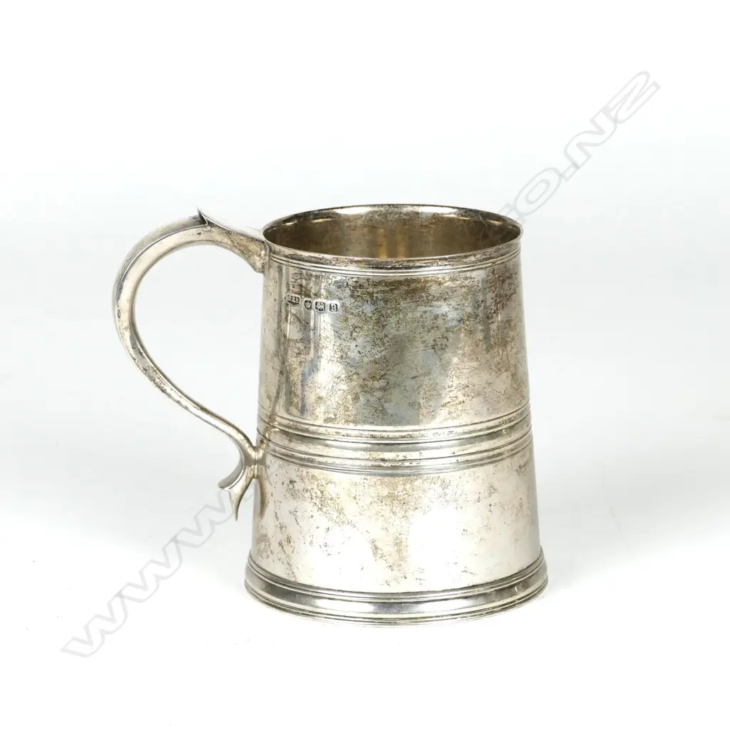 A silver mug Image 1++