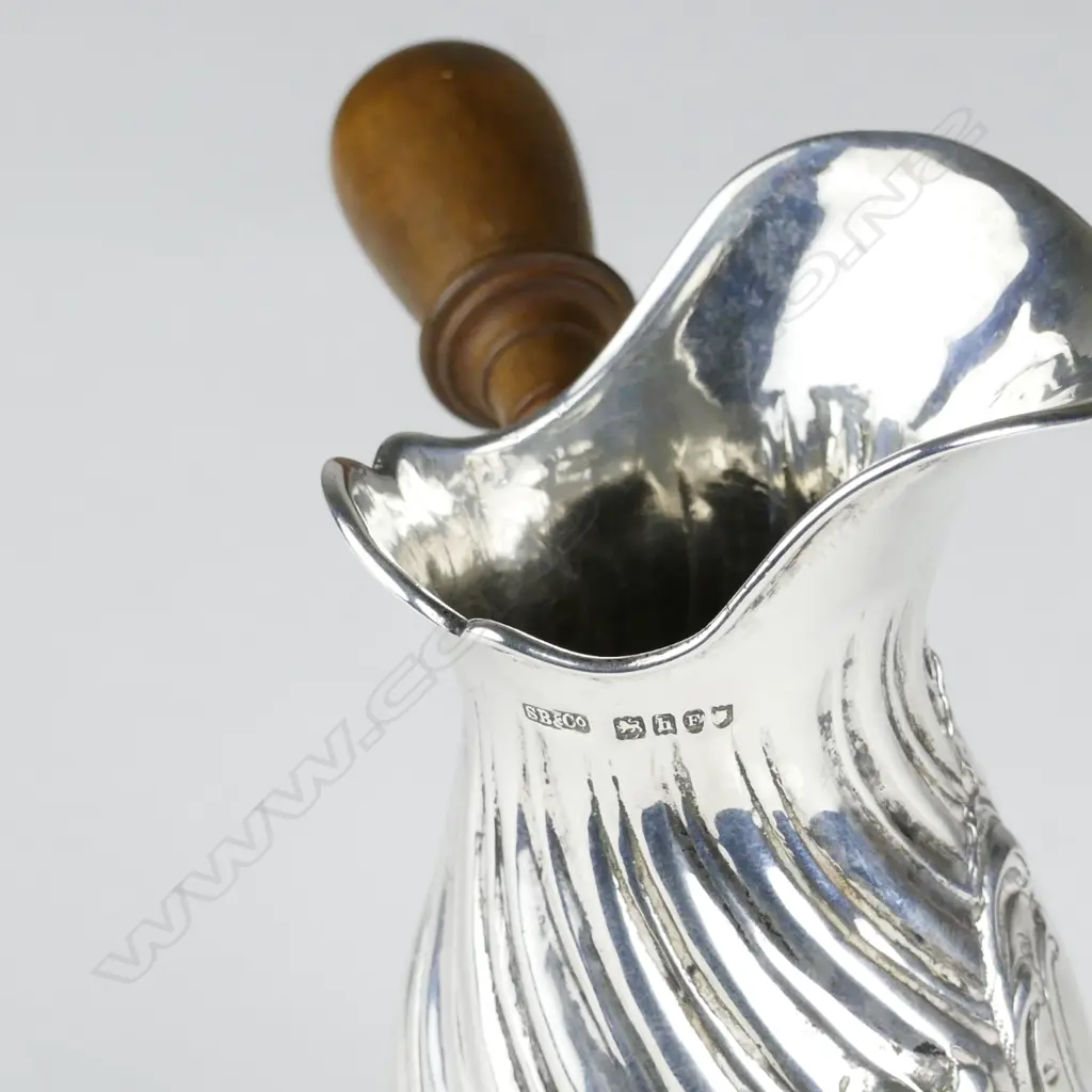 A small early 1900s silver jug Image 1++