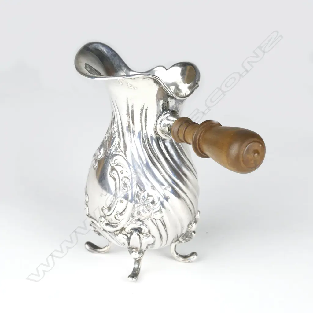 A small early 1900s silver jug Image 1++