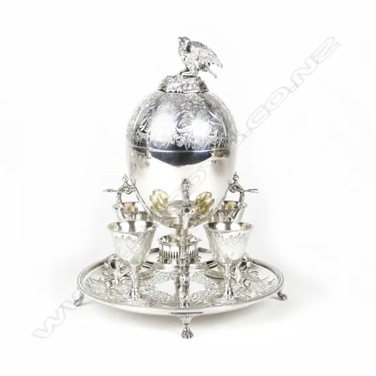 An ornate Victorian silver plate egg warmer and server