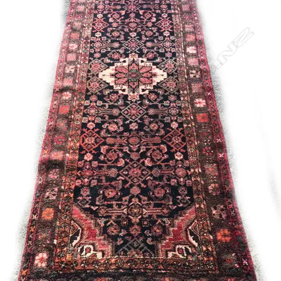 An old hand knotted Persian Hamadan runner