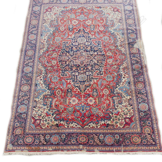 An old Persian Tabriz hand knotted carpet
